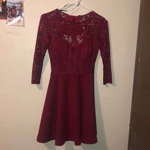 Red holiday dress with flowy skirt, lace top.